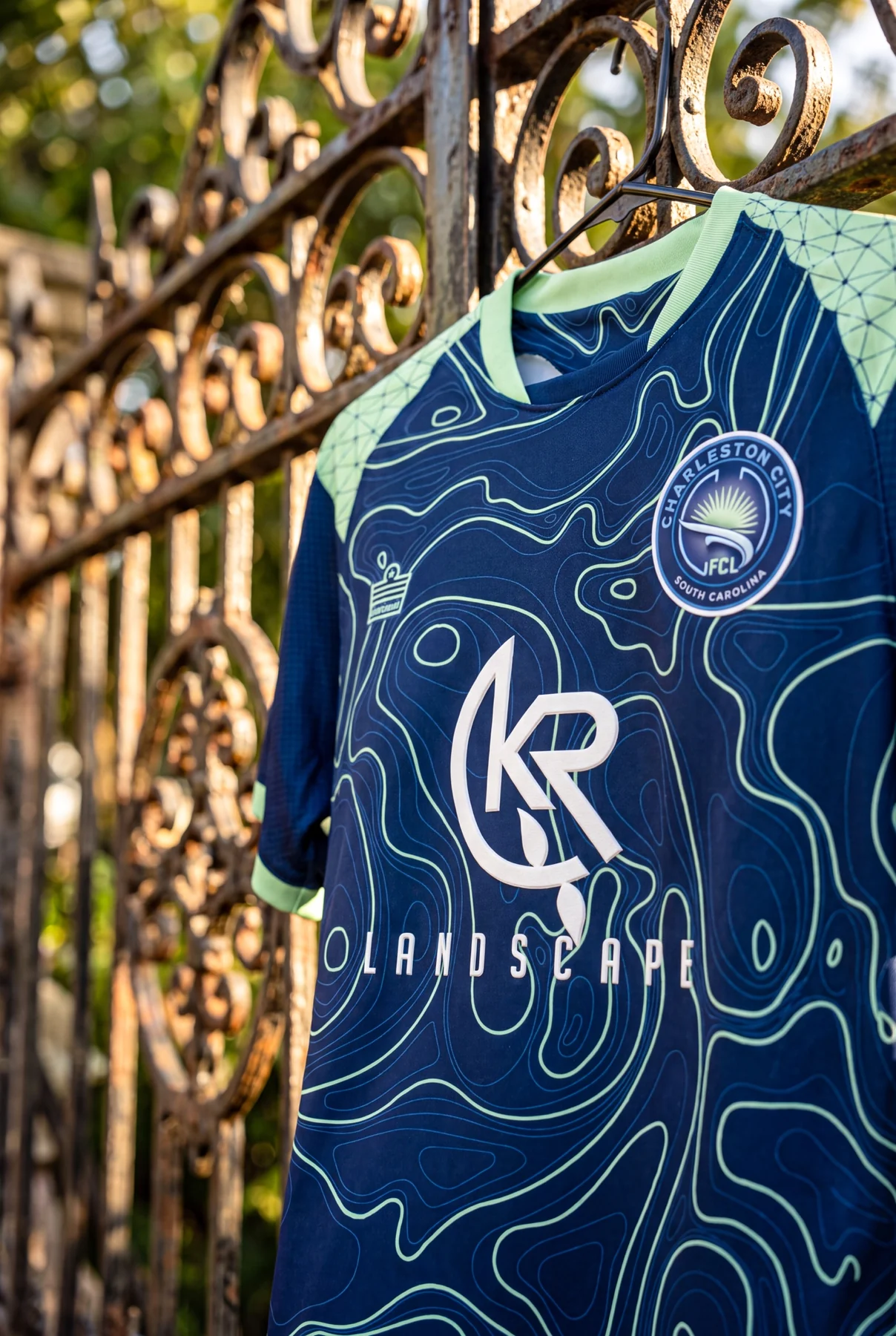Charleston City FC navy jersey showing the topographic pattern
