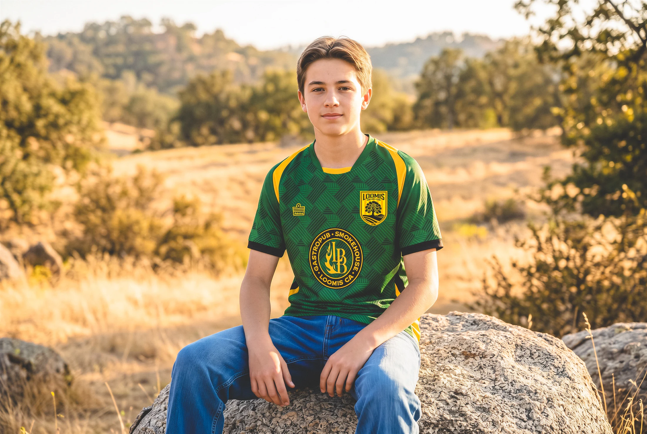 Loomis player seated in the foothills wearing the alternate shirt
