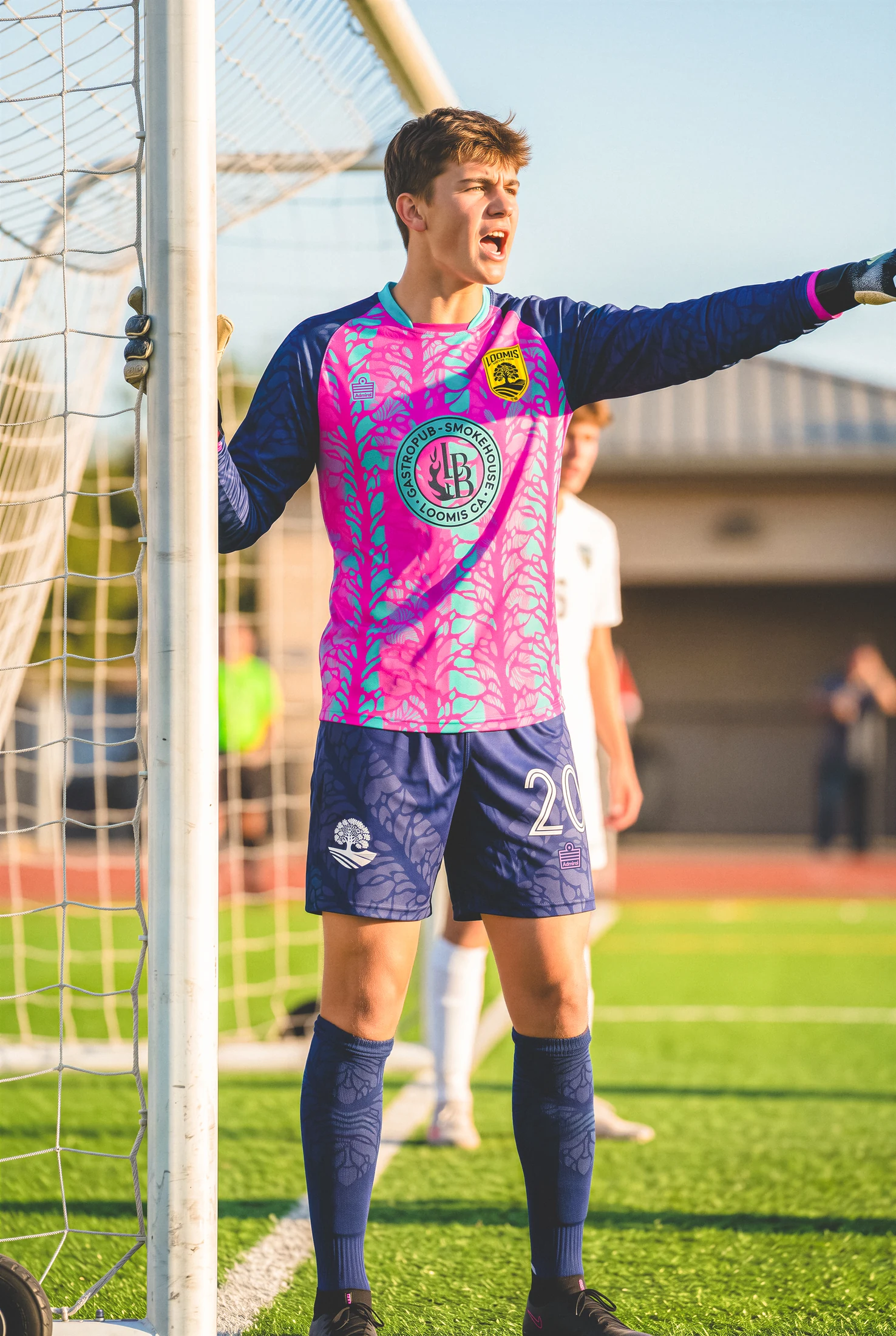 Loomis goalkeeper in a pink and purple kit at the goal
