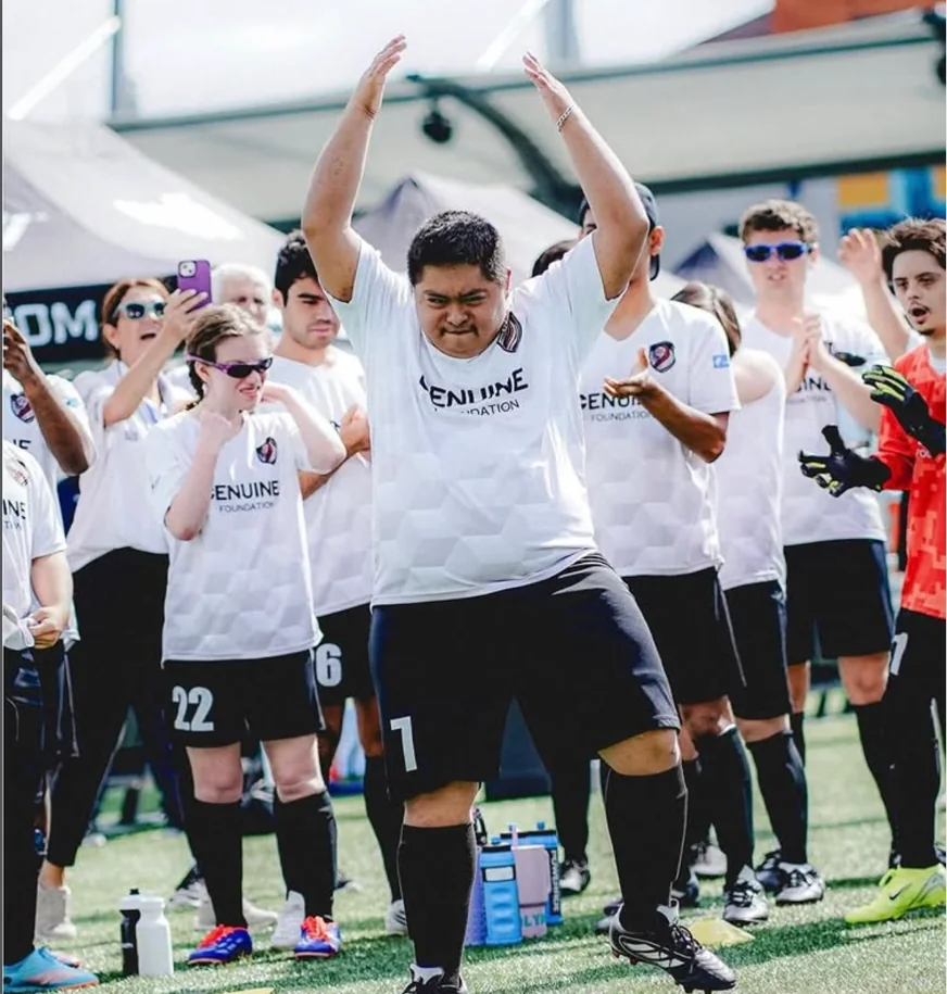 United Genuine FC players celebrating on the field